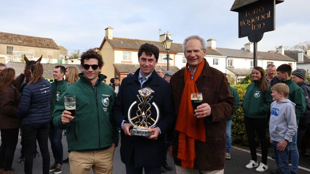 Emmet Mullins (centre) holds the trophy next to Sam (left) and Robert Waley-Cohen