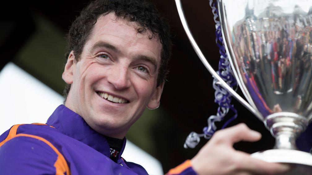 Patrick Mullins with the trophy after winning the Punchestown Champion Hurdle on Wicklow Brave