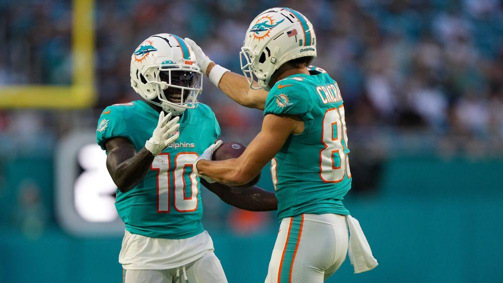 Tyreek Hill (left) celebrates with Miami Dolphins teammate River Cracraft