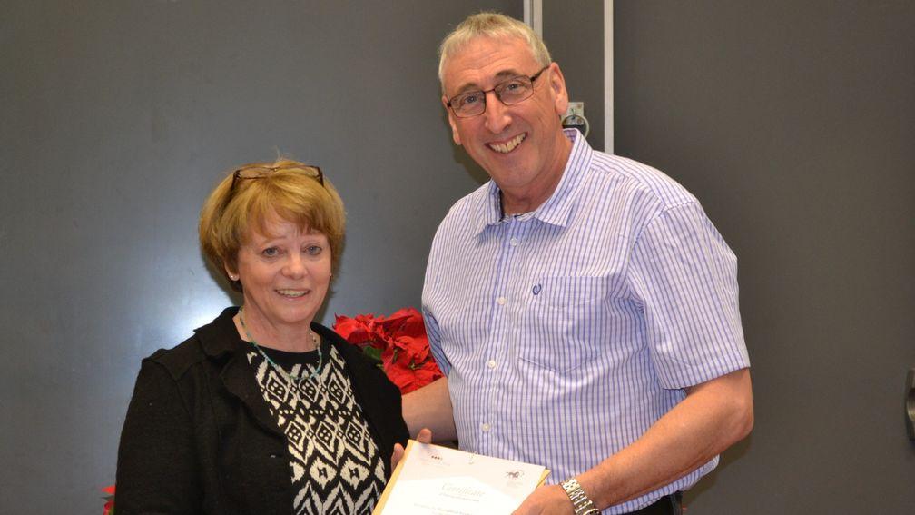 Mick Littlefair receives his diploma from TBA education and welfare manager Caroline Turnbull