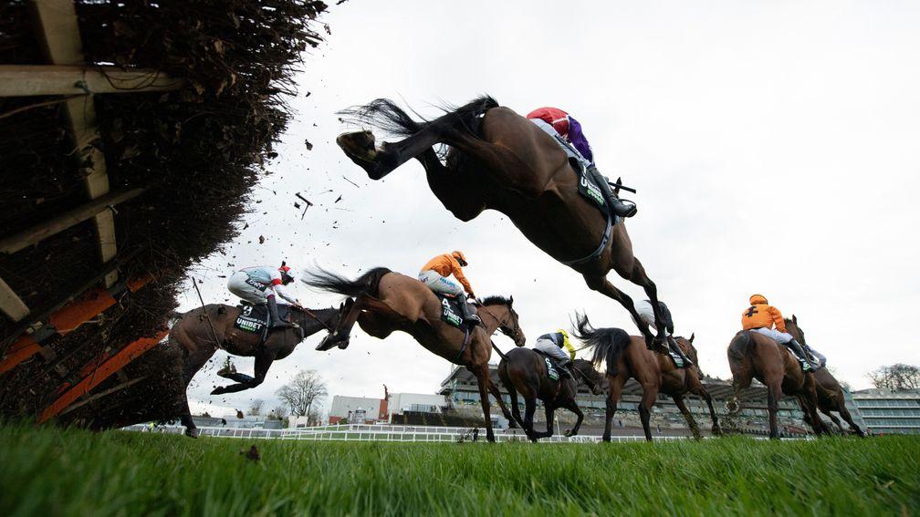The winner Metier (Sean Bowen,4) jumps the second flight during their win in the Tolworth HurdleSandown 2.1.21 Pic: Edward Whitaker/ Racing Post