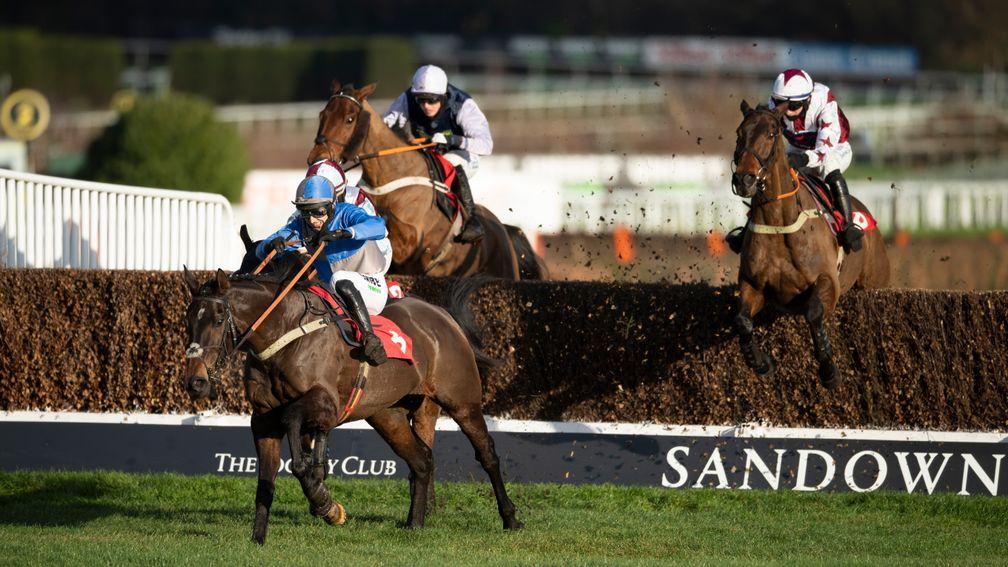 Doitforthevillage (Tom O'Brien,right) jumps the last fence and wins the 2m 4f handicap chaseSandown 2.1.21 Pic: Edward Whitaker/ Racing Post