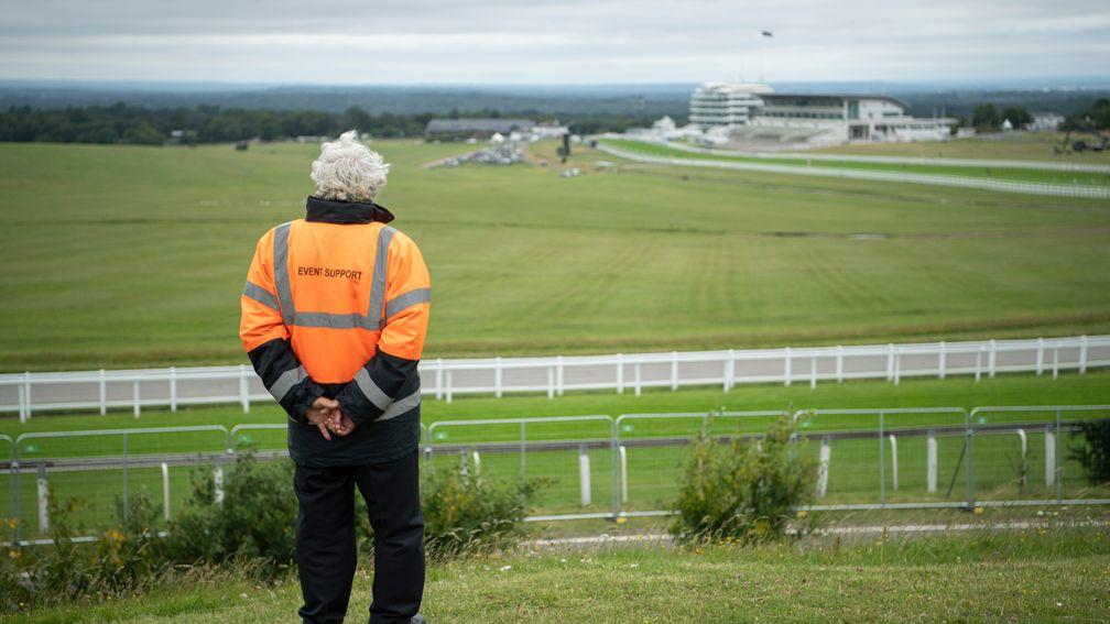 A security man looks out over a locked down Epsom racecourse on Derby Day morningEpsom 4.7.20 Pic: Edward Whitaker/Racing Post