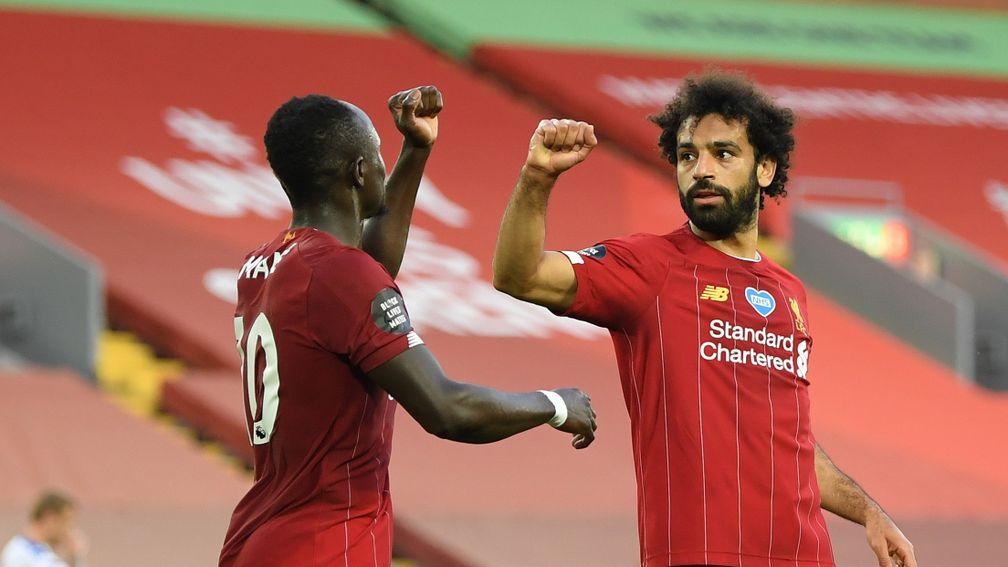 Liverpool's Mohamed Salah celebrates with Sadio Mane