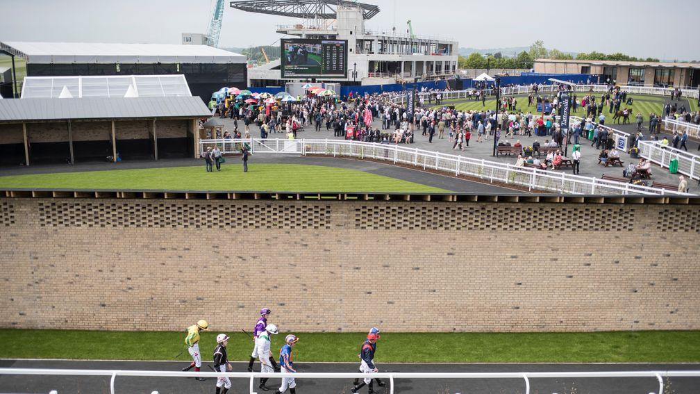 Jockeys head towards the parade ring for the opener at the Curragh on Sunday