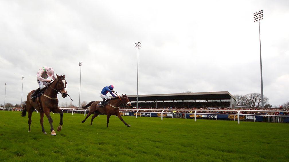 Cue Card (far side) battles on gallantly to beat Vautour in a King George Classic
