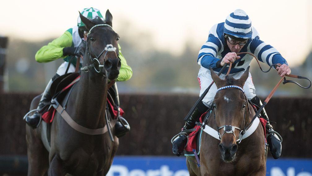 Whisper (Davy Russell, right) beats sole rival Clan Des Obeaux in the graduation chase at Kempton
