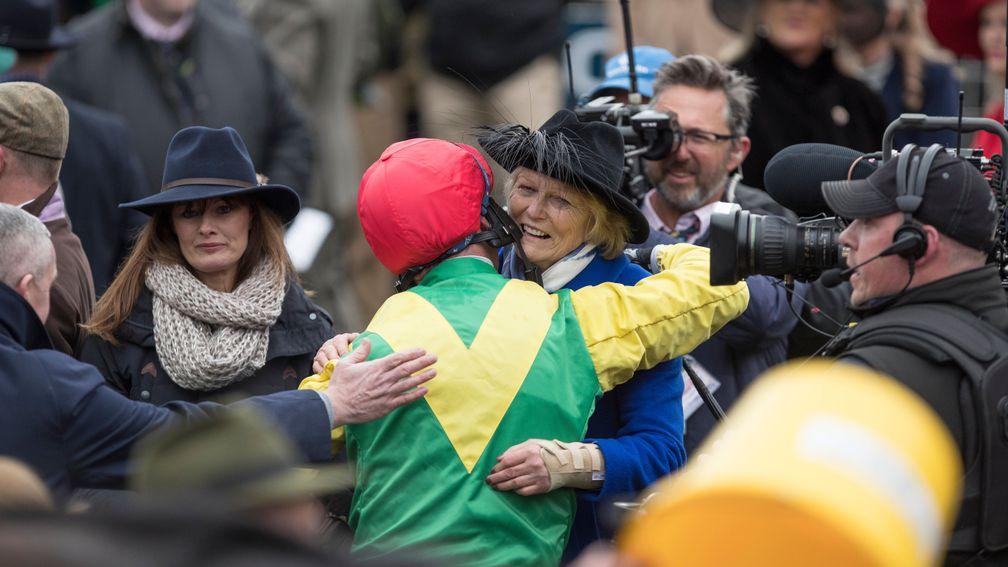 Jessica Harrington and Robbie Power embrace after Gold Cup victory with Sizing John