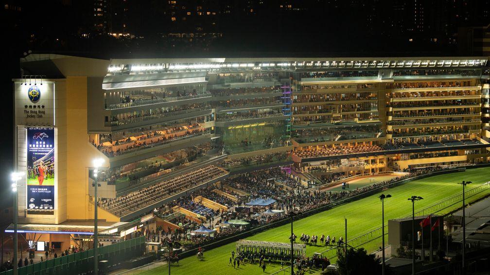 Runners break from the stalls for the 1,650m race in the Longines International Jockeys' Championship meeting at Happy Valley
