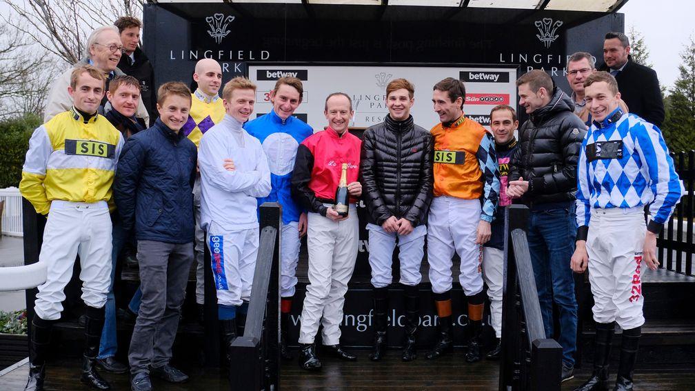 Steve Drowne presented with a bottle of champagne by fellow jockeys and colleagues before his final race.Lingfield Park - 31.12.17John Hoy - focusonracing.com