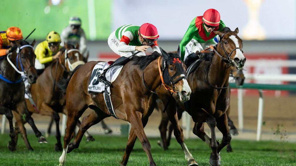 Facteur Cheval (right) and Maxime Guyon holds off the fast-finishing Namur to land Dubai Turf for France