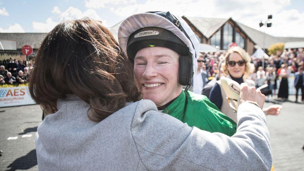 Carberry is hugged by Katie Walsh after announcing her retirement