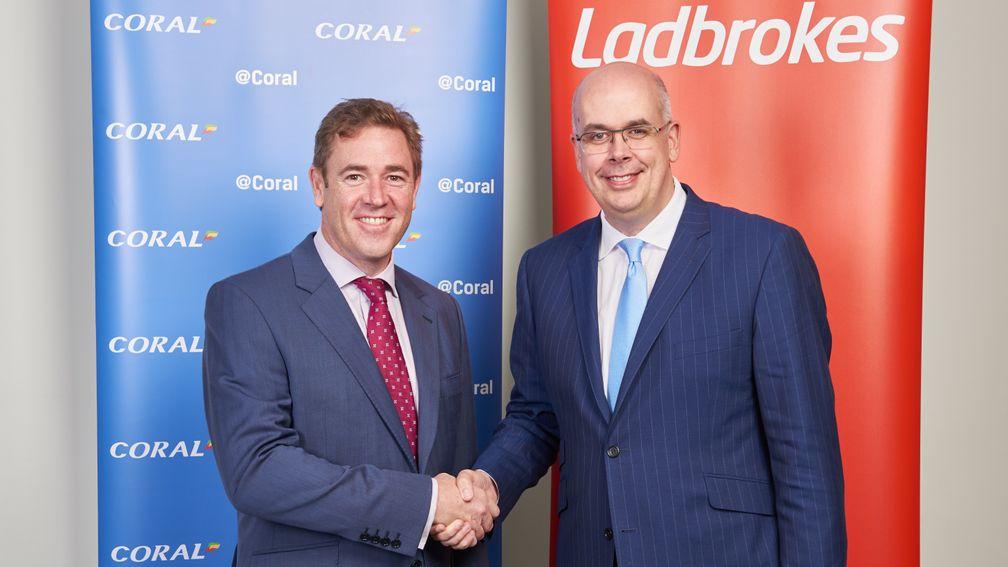 Gala Coral chief executive Carl Leaver (left) and Ladbrokes chief executive Jim Mullen shake on their merger last year
