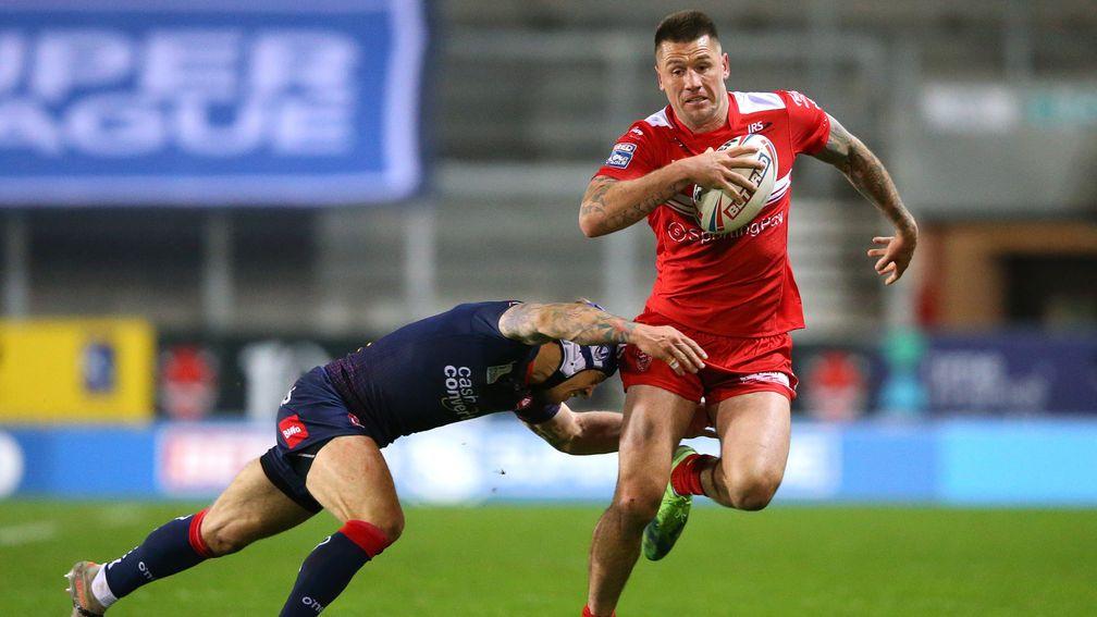 Shaun Kenny-Dowall of Hull KR tries to skip away from a tackler