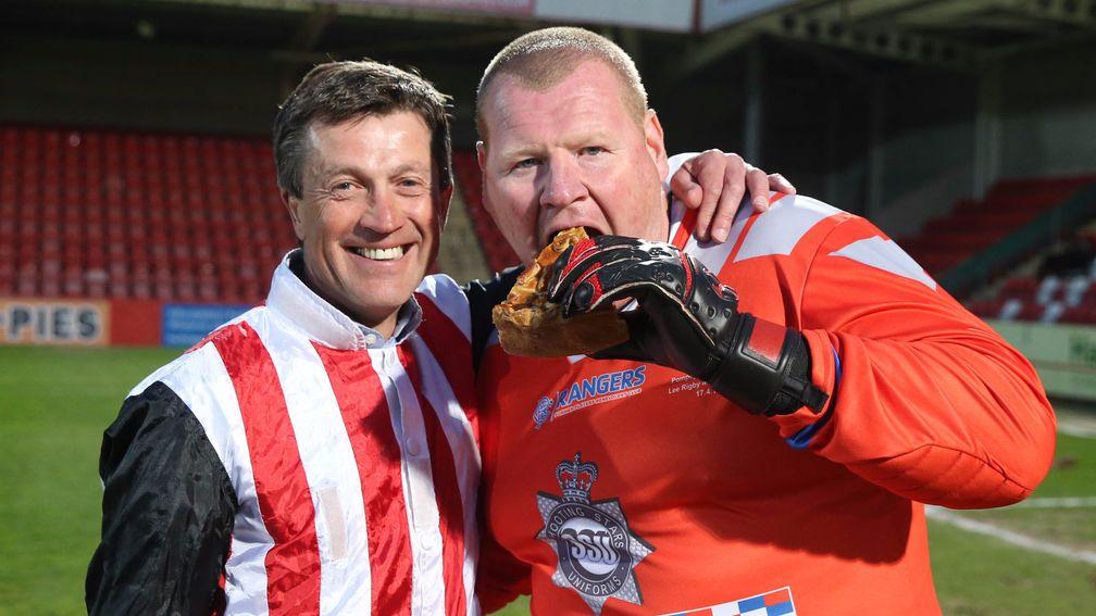 Goalkeeper Wayne Shaw, complete with pie, gets ready to face Carl Llewellyn in the penalty shootout