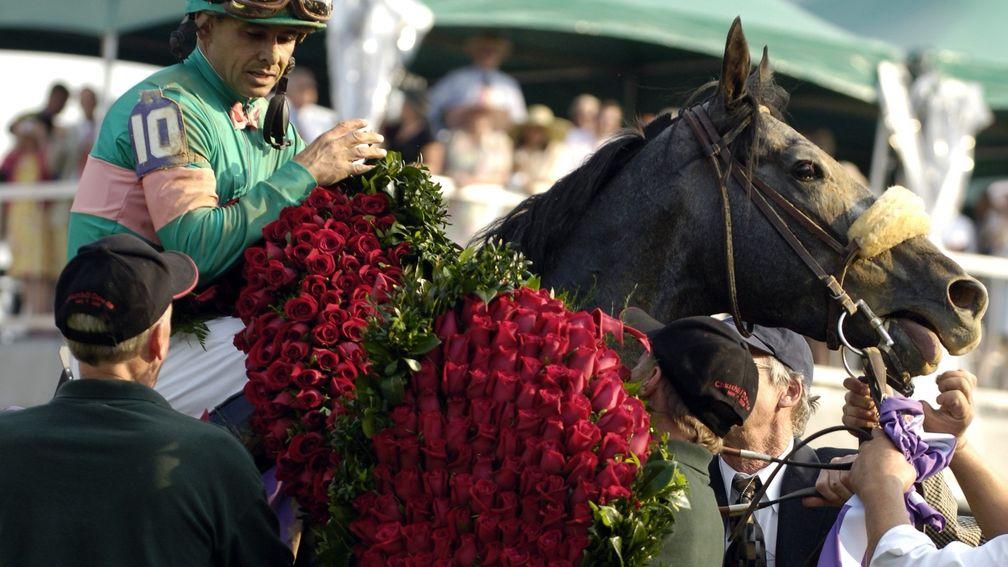 Giacomo and Mike Smith receive the roses after winning the Kentucky Derby