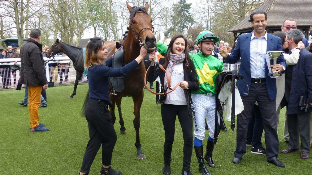Coeur De Beaute with jockey Stephane Pasquier and owner Ahmed Mouknass (holding trophy) after landing the Prix Imprudence at Deauville