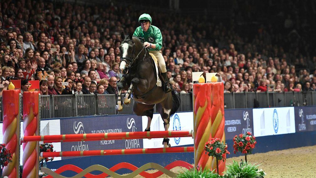 Frankie Dettori takes the final jump on his way to a clear round