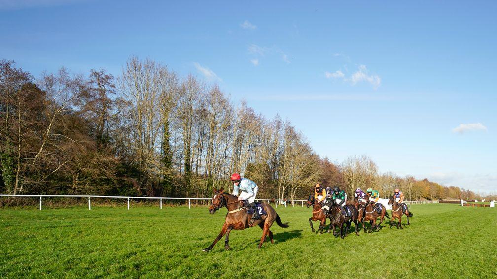 Anythingforlove (red cap) en route to landing her first GBB bonus at Lingfield