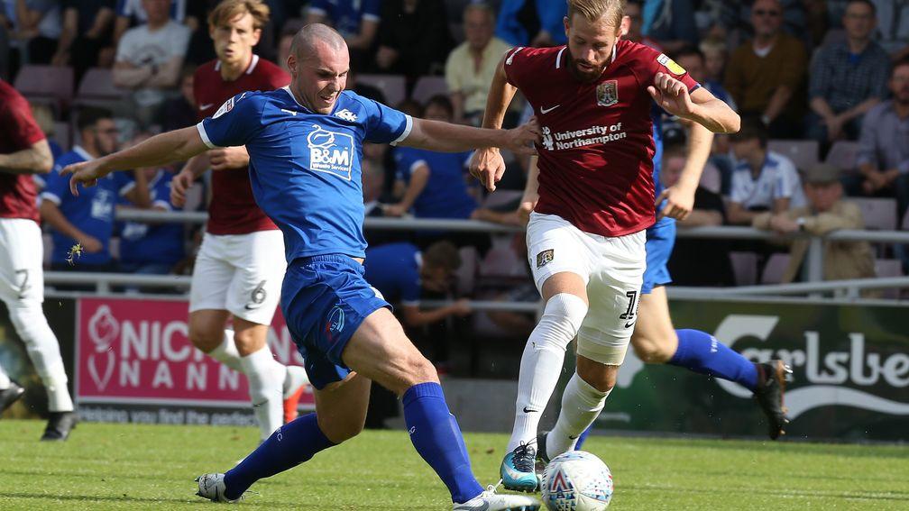Tranmere's Luke McCullough tackles Northampton's Kevin Van Veen