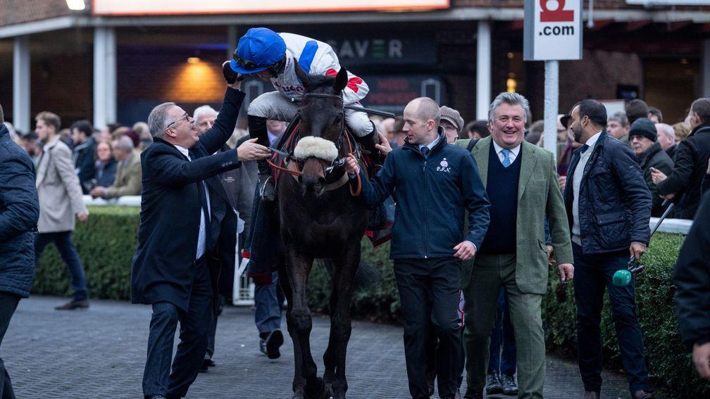 Harry Cobden is greeted by part owner Ged Mason after Clan Des Obeauxâs victoryKempton 26.12.18 Pic: Edward Whitaker
