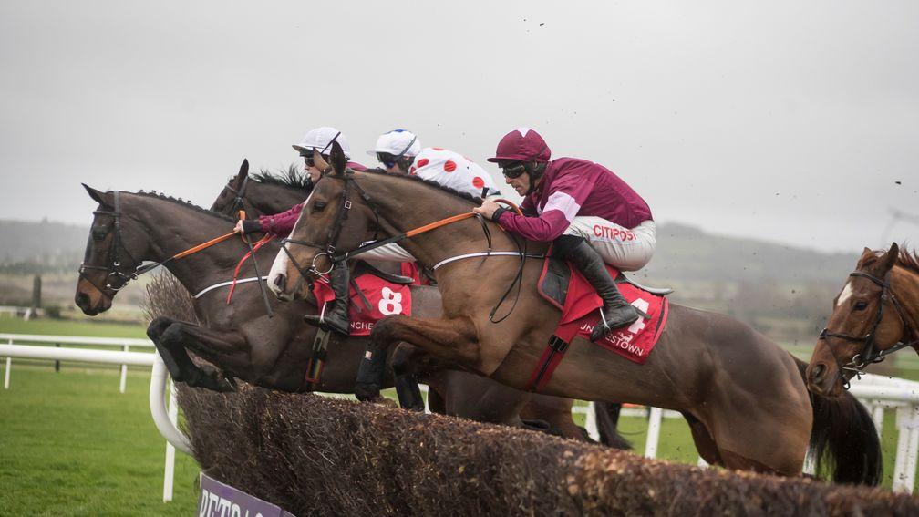 Mengli Khan (maroon cap) measures a fence well under Davy Russell