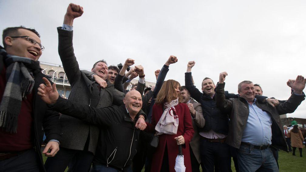 The Poor Man's Syndicate celebrate The Church Gate's win in the Irish Daily Star Christmas Handicap Hurdle at Leopardstown