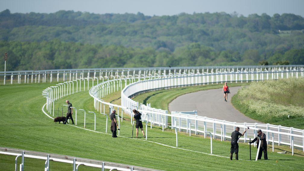 The temporary rail for Friday's Oaks card is put in place at Epsom this week