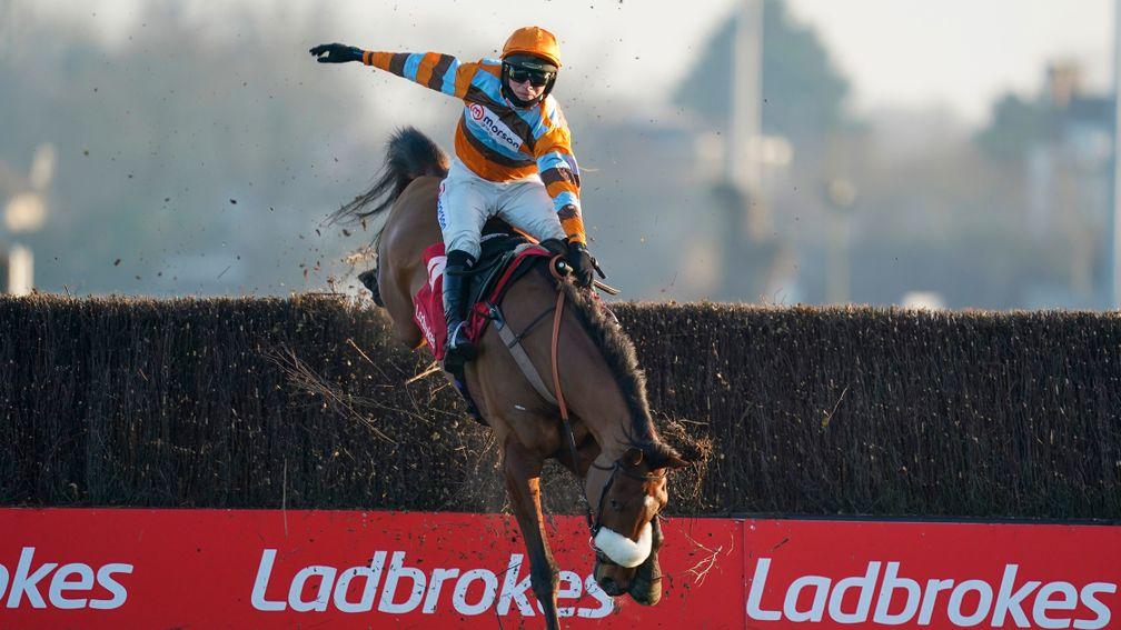 Hold on tight: Harry Cobden had to display some cowboy-riding talents to keep the partnership with Master Tommytucker intact at the final fence