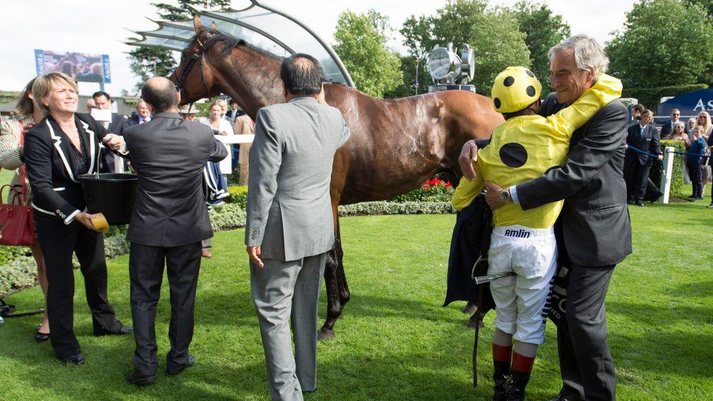 Luca Cumani hugs Andrea Atzeni after Postponed's success in the 2015 King George – but owner Sheikh Mohammed Obaid removed the horse from Cumani's yard not long later