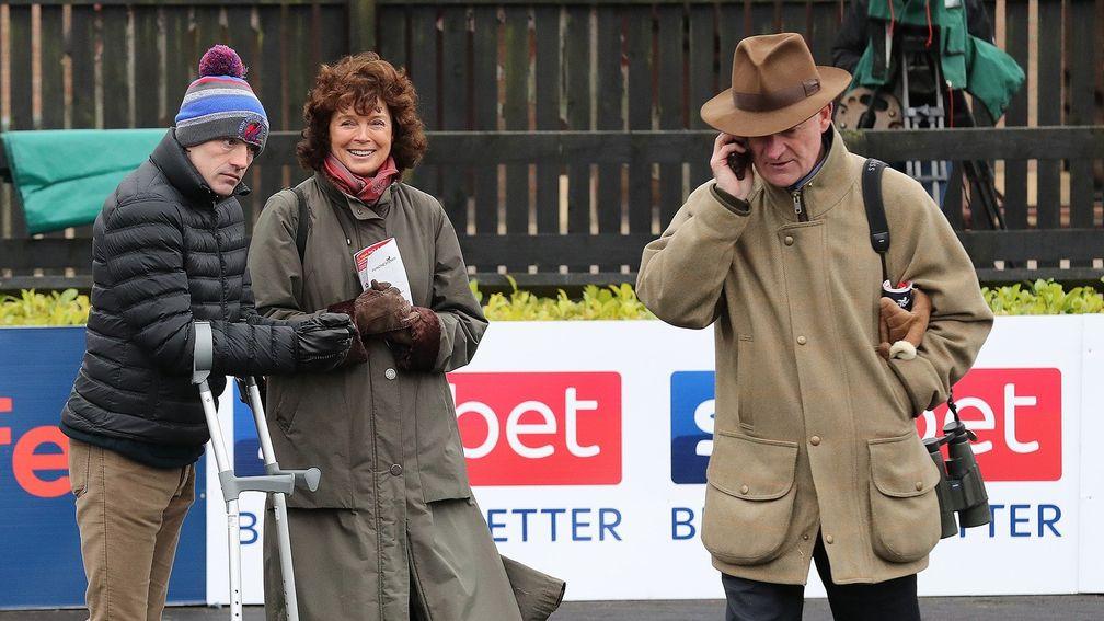 Willie Mullins passes on the news of Getabird's success as Ruby Walsh, on crutches, and Jackie Mullins look on