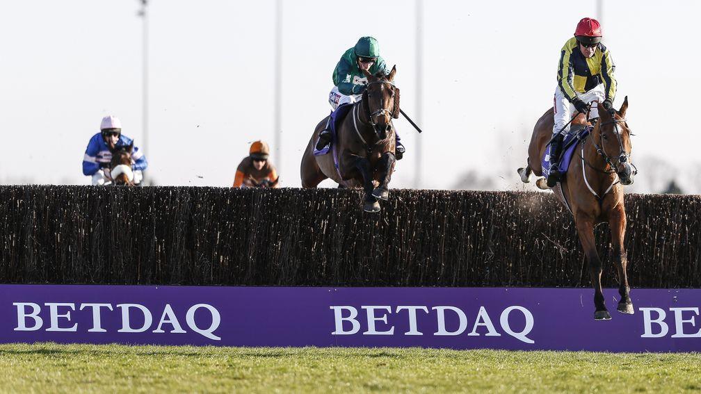 SUNBURY, ENGLAND - FEBRUARY 24:  Barry Geraghty riding Master Dee (R) clear the last to win The Betdaq Handicap Chase at Kempton Park racecourse on February 24, 2018 in Sunbury, England. (Photo by Alan Crowhurst/Getty Images)