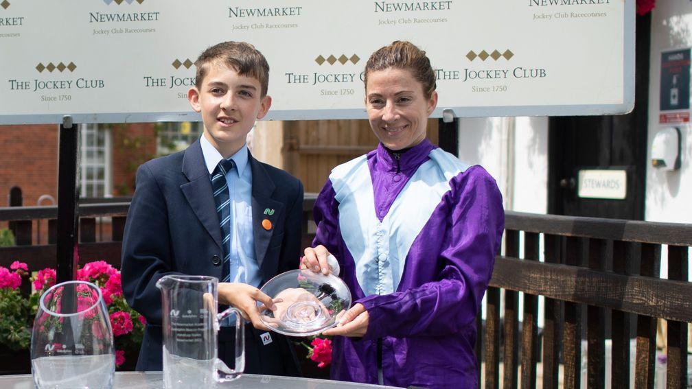 Elliott Honeyball presents Hayley Turner with her prize after the Newmarket Academy Godolphin Beacon Project Handicap