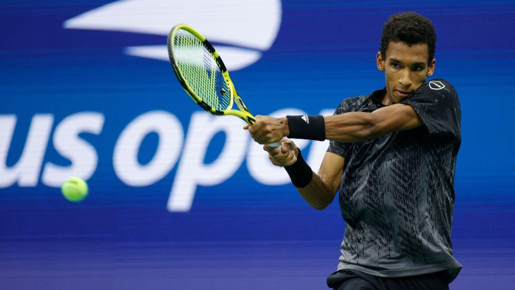Felix Auger-Aliassime looks a picture of poise on his way to victory over Carlos Alcaraz, who retired early in their quarter-final clash