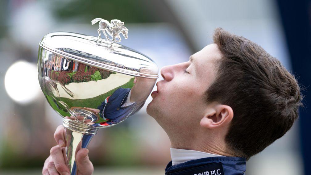 Oisin Murphy celebrates winning his third British Flat jockeys' championship
