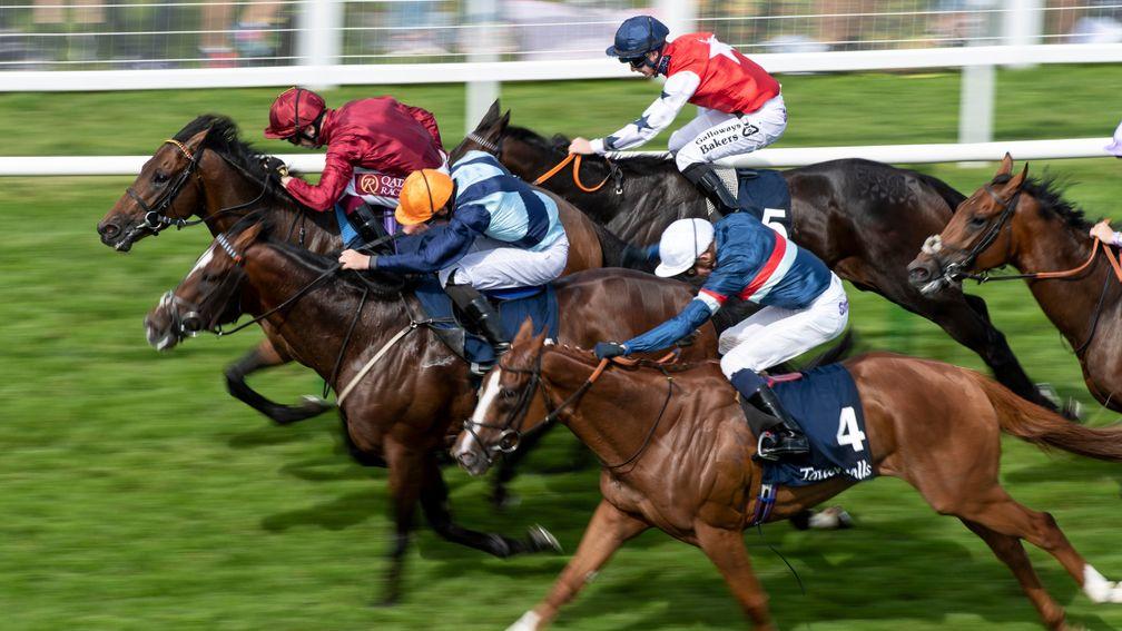Accidental Agent (Charlie Bishop, orange cap) just fails to catch Kick On (Oisin Murphy) in the Sovereign Stakes at Salisbury