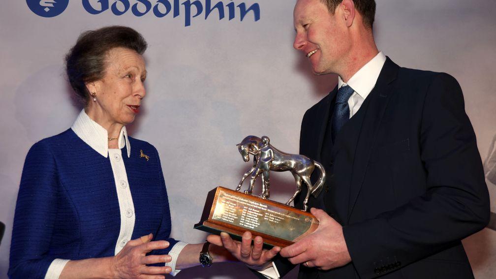 The Princess Royal presents David Porter-Mackrell with his Employee of the Year trophy at Ascot