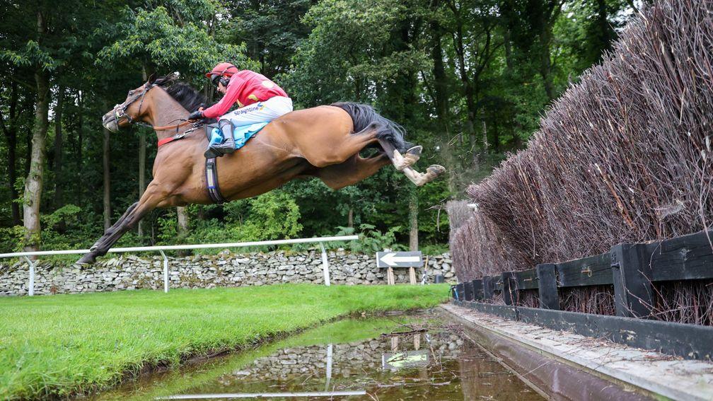 Tonto's Spirit soars over the water jump on his way to a record-equalling victory at Cartmel
