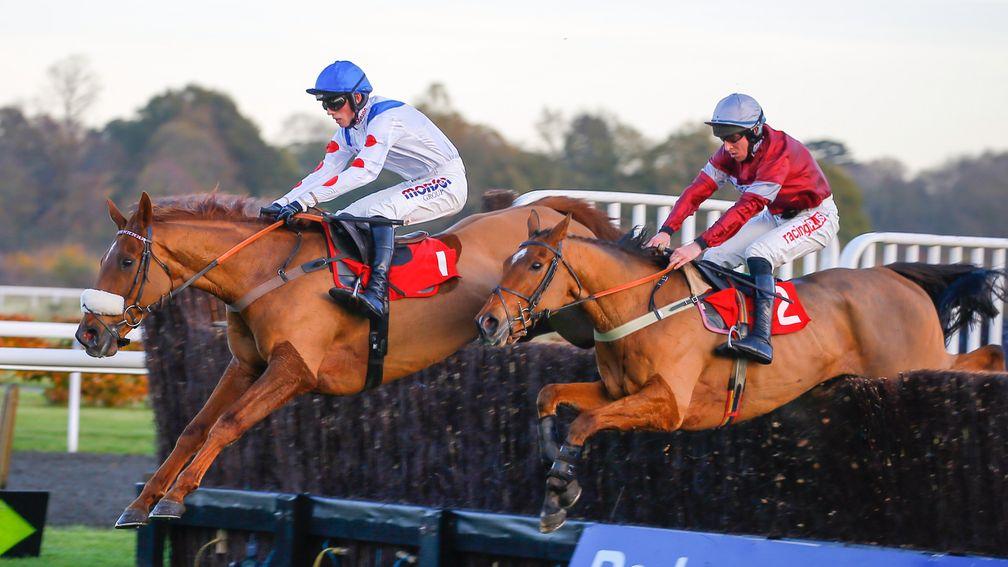 Give Me A Copper and Harry Cobden (far side) on the way to victory over sole rival Three Ways in the novice chase