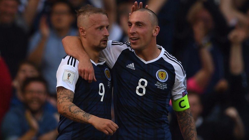Scotland's Leigh Griffiths (left) and Scott Brown celebrate against England