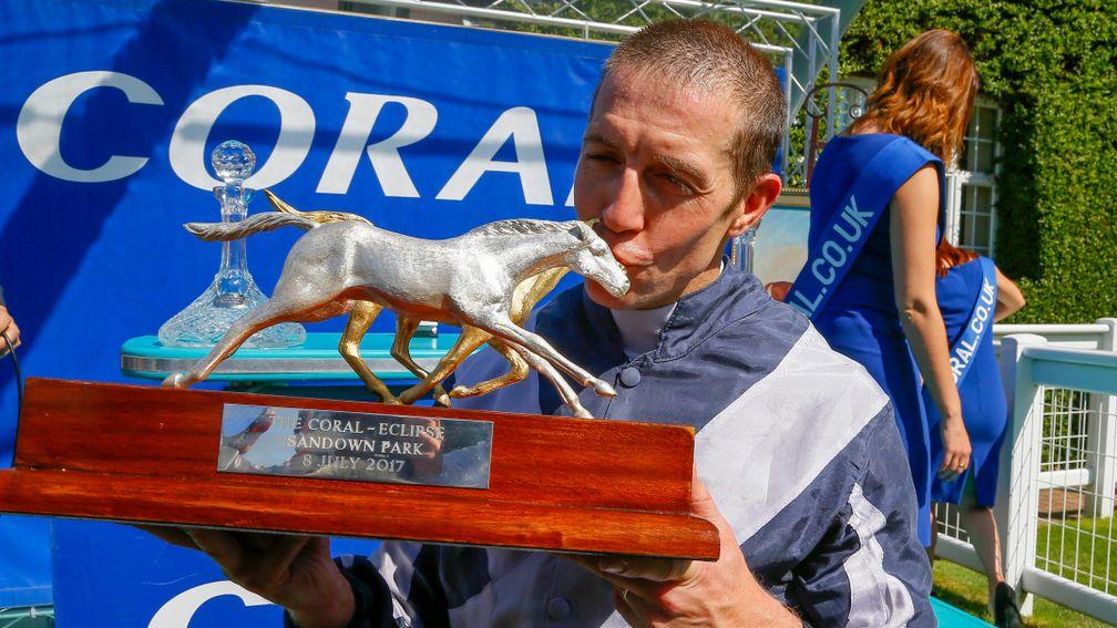 Jim Crowley kisses the Coral-Eclipse trophy after his victory on Ulysses