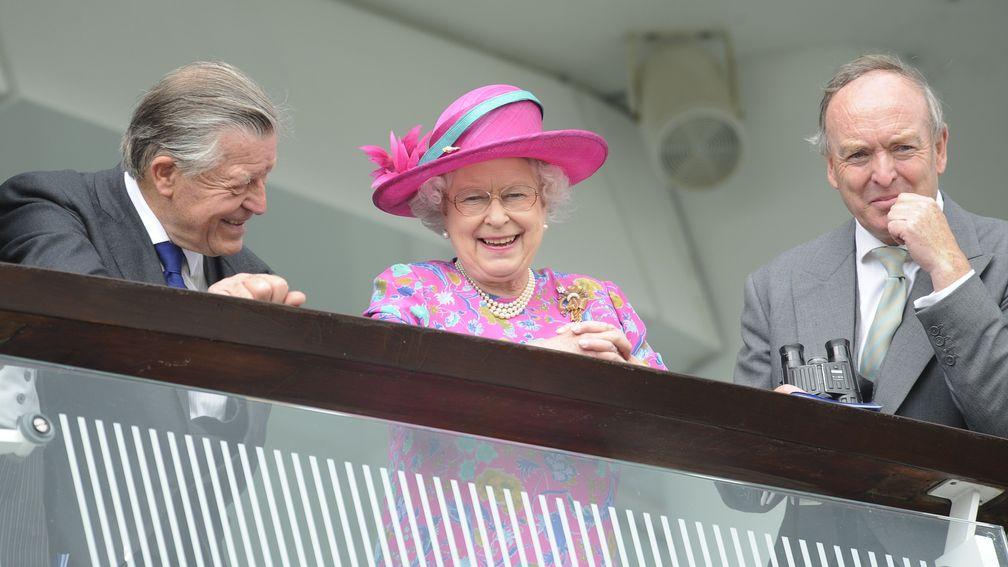 Queen Elizabeth II with Sir Michael Oswold (l) and Julian Richmond Watson owner of Friday's Oaks winner