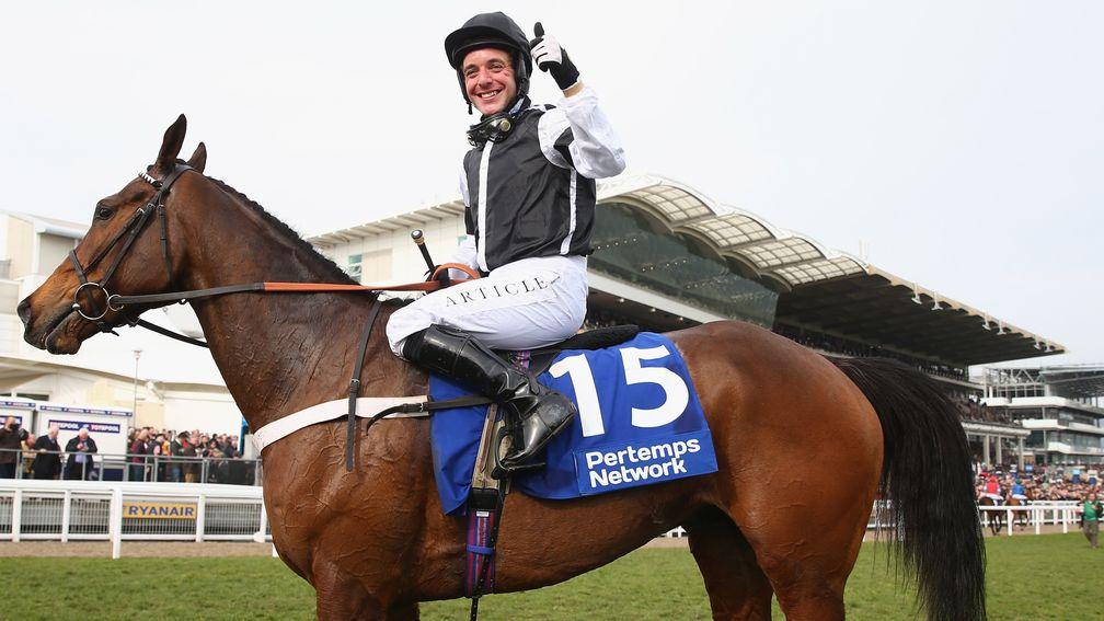 CHELTENHAM, ENGLAND - MARCH 12:  Andrew Tinkler riding Call The Cops celebrates victory in the Pertemps Network Final hurdle race during day three of the Cheltenham Festival at Cheltenham Racecourse on March 12, 2015 in Cheltenham, England.  (Photo by Mic