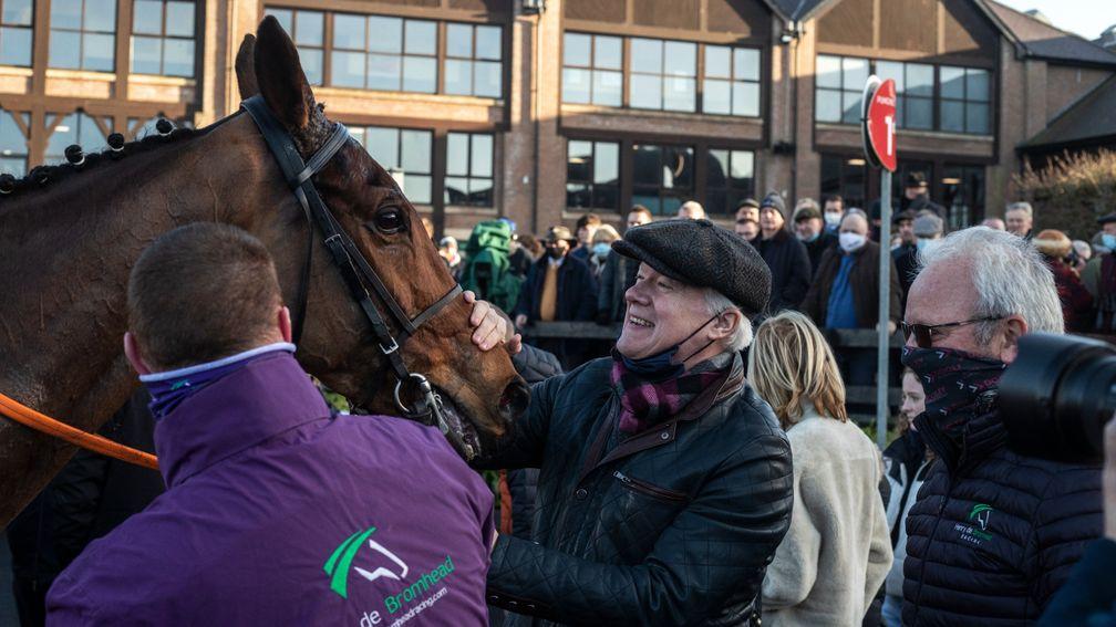 Thrilled owner Brian Acheson gives Bob Olinger a pat after his Punchestown victory