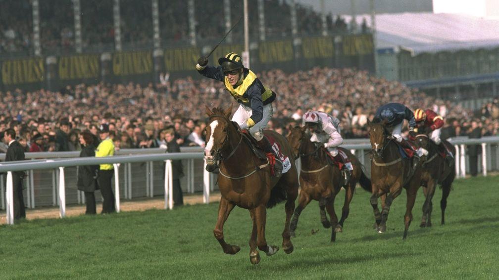 Tony McCoy salutes the crowd after running away with the 1997 Champion Hurdle on Make A Stand