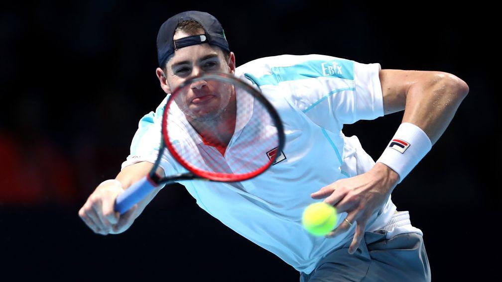 John Isner stoops on the way to being conquered by Novak Djokovic