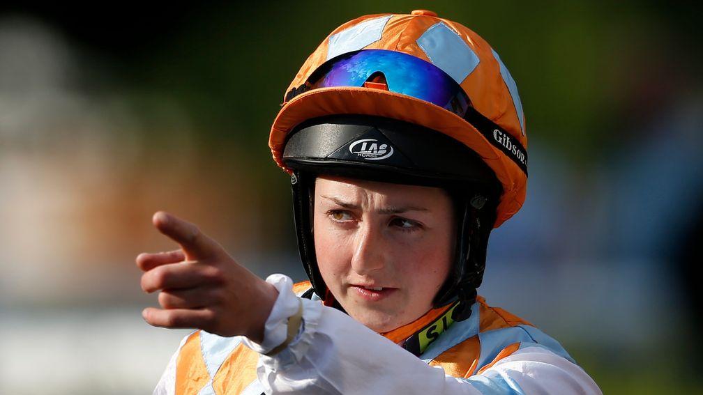 Gina Mangan, pictured on the way to the Kempton parade ring last night, cannot ride Diore Lia in the Derby under a BHA rule. Connections say the horse will not take part without her