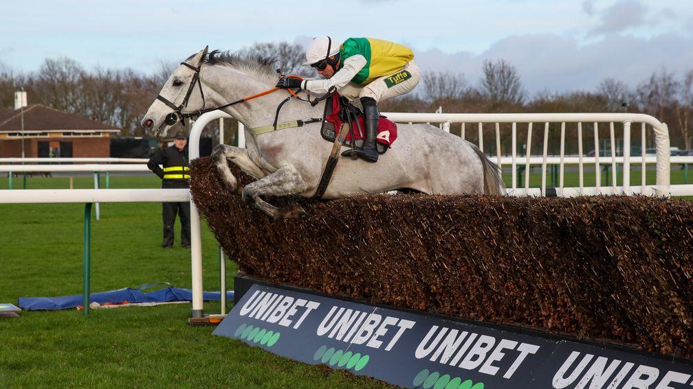 Vintage Clouds: puts in a fine leap to run out an impressive winner of the Peter Marsh Chase