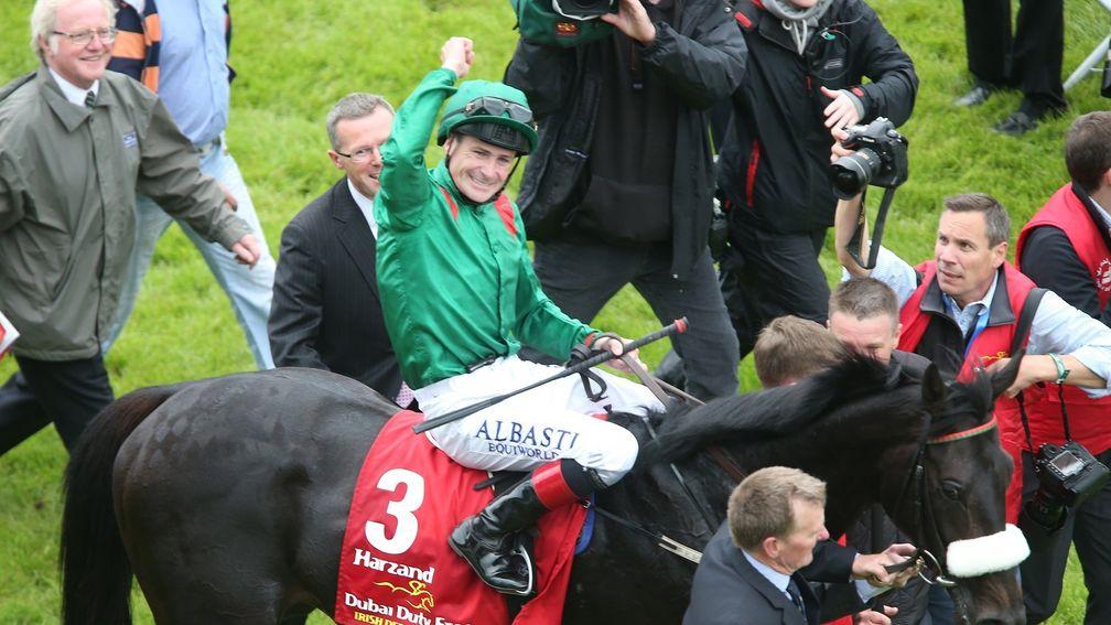 Legendary rider Pat Smullen celebrates after winning the Irish Derby on Harzand in 2016