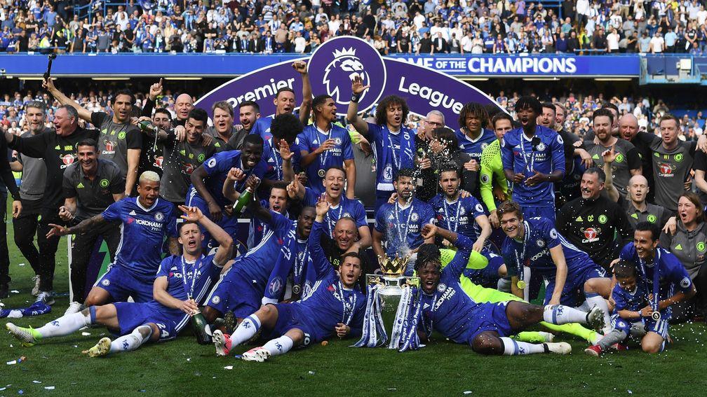 Chelsea celebrate with the Premier League trophy